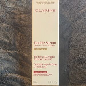 Clarins Compact Skincare Box with Red Accents